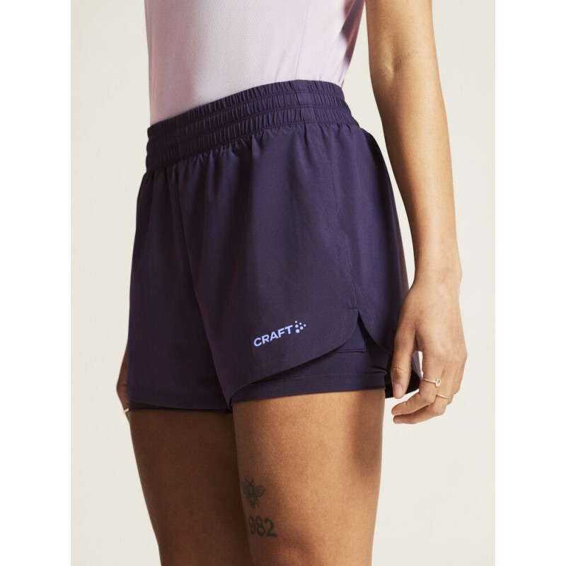 CRAFT ŽENSKE KRATKE HLAČE ADV ESSENCE 2-IN-1 SHORTS 2 TEMNO VIJOLIČNA DK PLUM