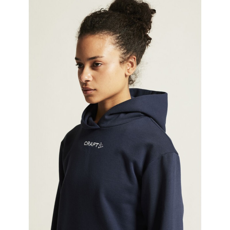 CRAFT ŽENSKI BOMBAŽEN PULOVER COMMUNITY 2.0. LOGO HOODIE NAVY